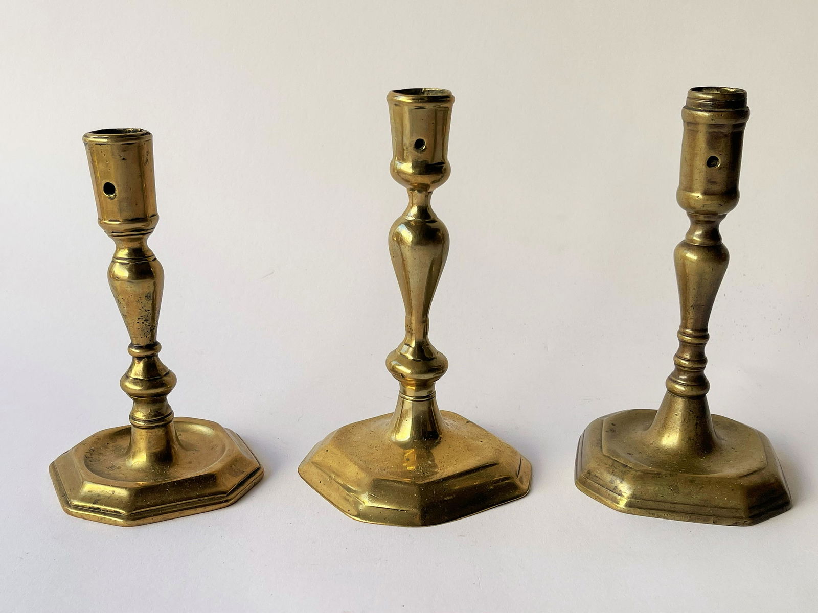THREE VERY EARLY 18TH C ENGLISH BRASS CANDLESTICKS (1 of 4)