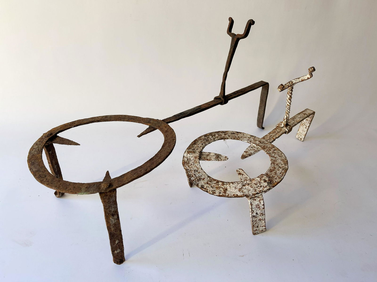 TWO IRON HEARTH TRIVETS (1 of 2)