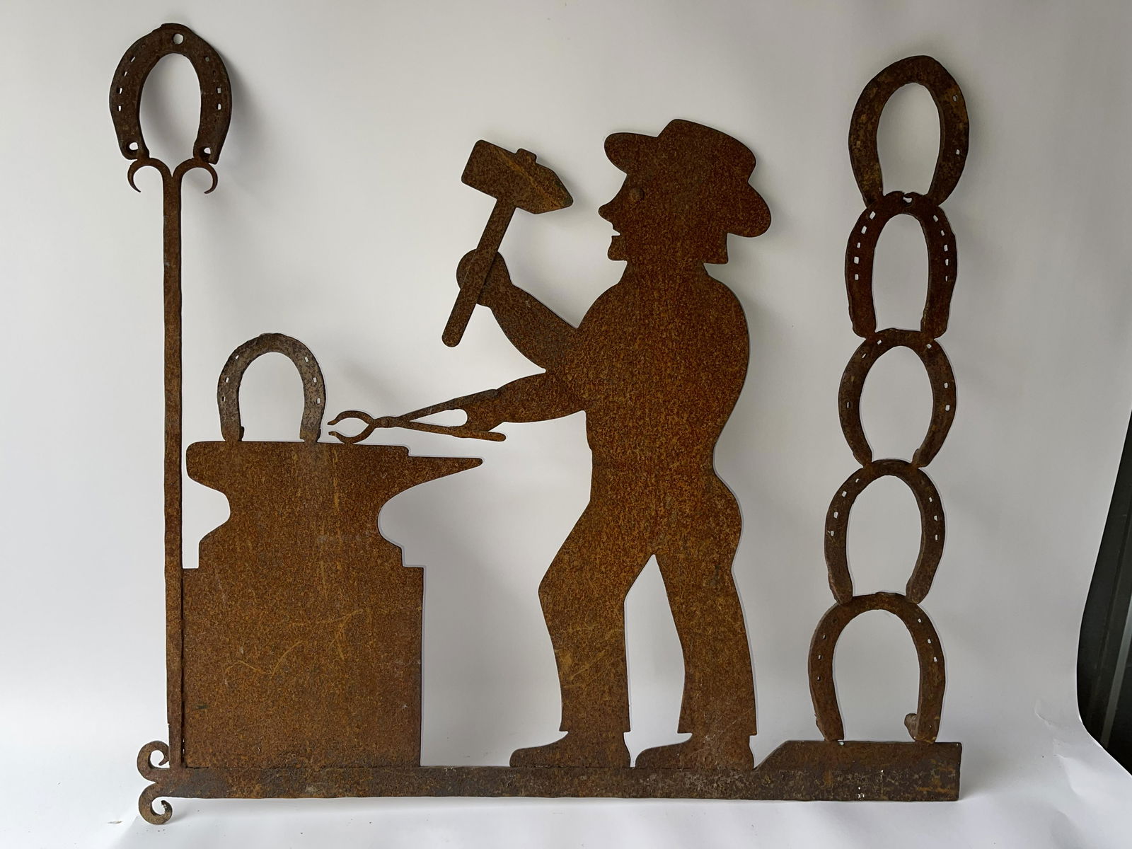 SHEET IRON FIGURATIVE BLACKSMITH SIGN (1 of 2)