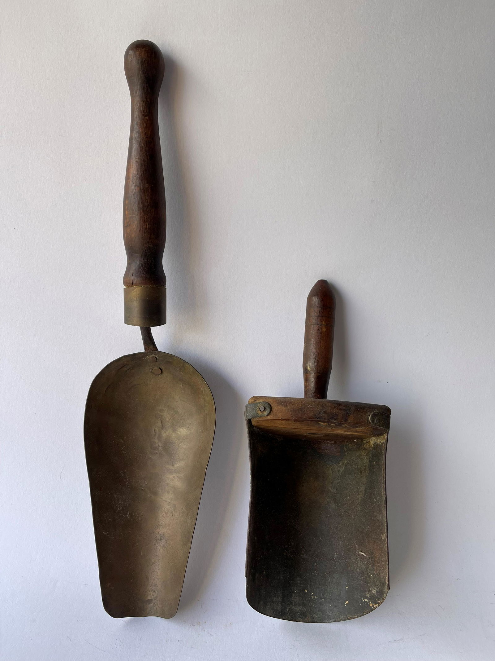 TWO PRIMITIVE TIN SCOOPS (1 of 2)