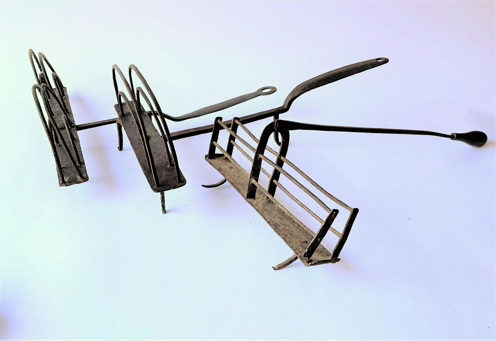 GROUPING OF THREE IRON HEARTH TOASTERS (1 of 4)