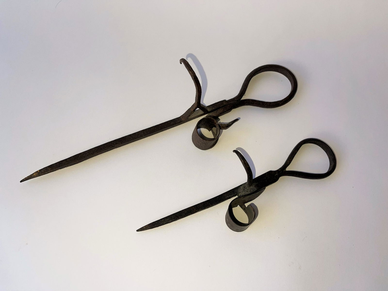 TWO 19TH C IRON STICKING TOMMIES (1 of 3)