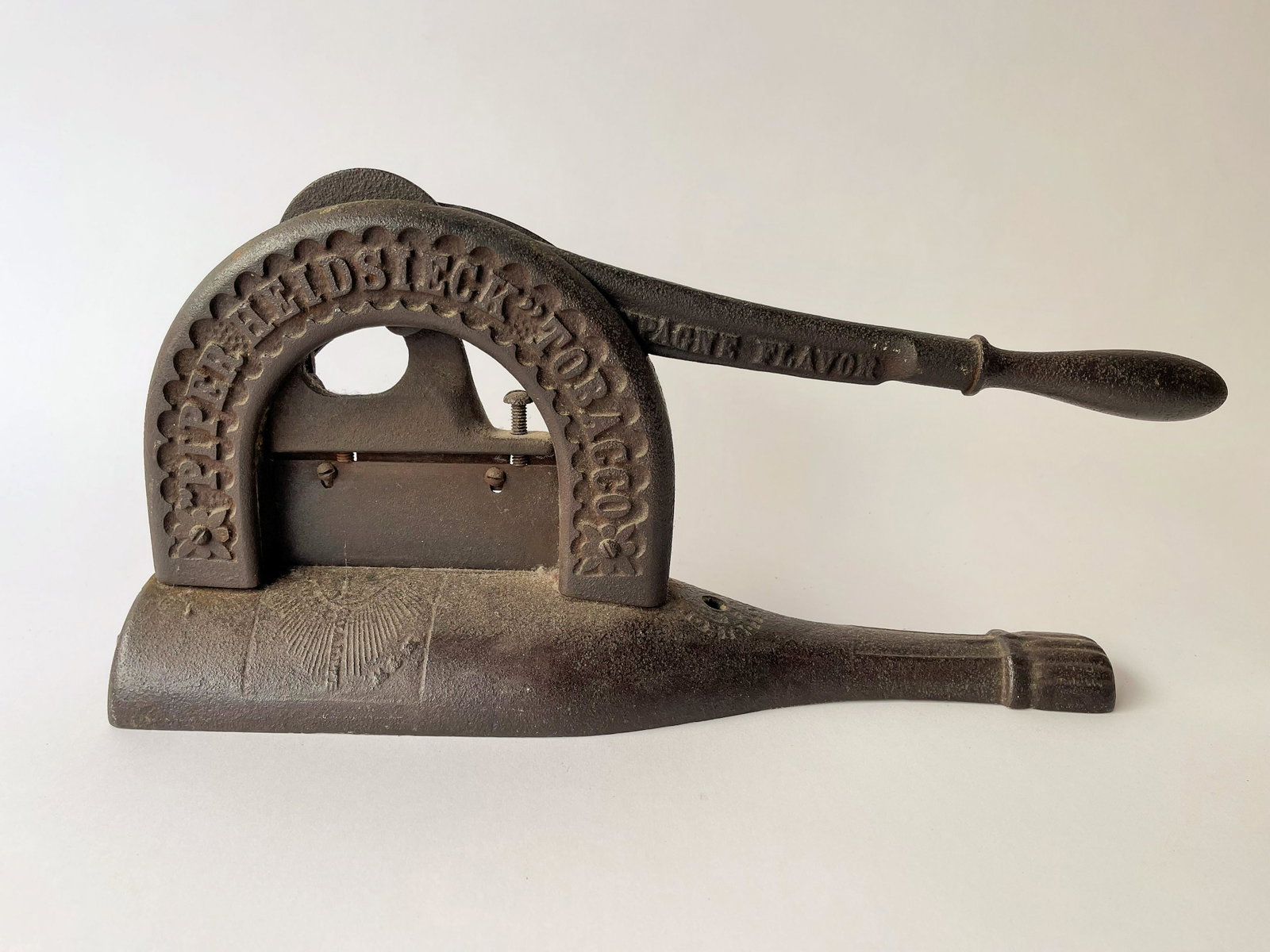 CAST IRON TOBACCO CUTTER: CAST IRON TOBACCO CUTTER, EMBOSSED AND SIGNED, 16 X 7