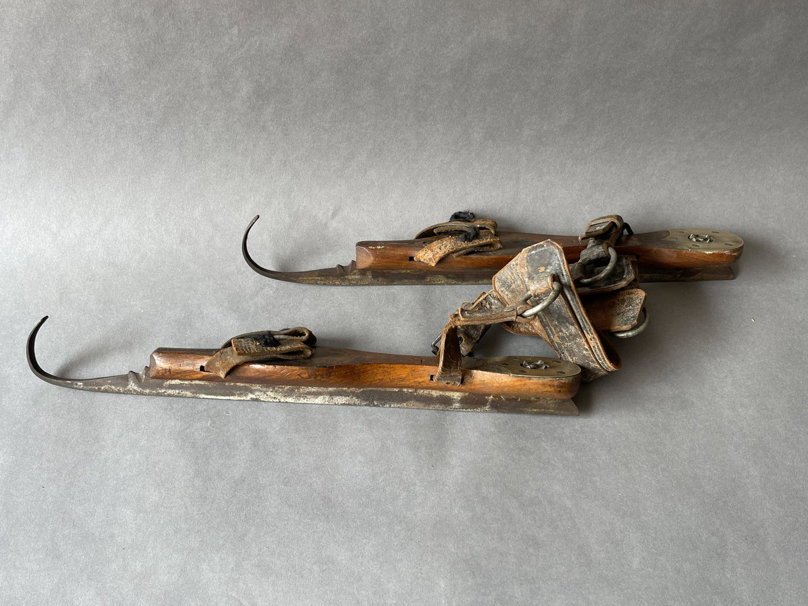 PAIR OF 18TH OR 19TH C WOODEN SKATES W/ DECORATIVE IRON BLADES: PAIR OF 18TH OR 19TH C WOODEN SKATES W/ DECORATIVE IRON BLADES 15"