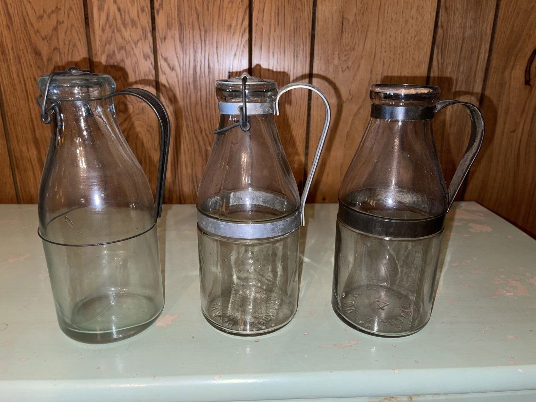 GROUPING OF THREE GLASS MILK BOTTLES (1 of 1)