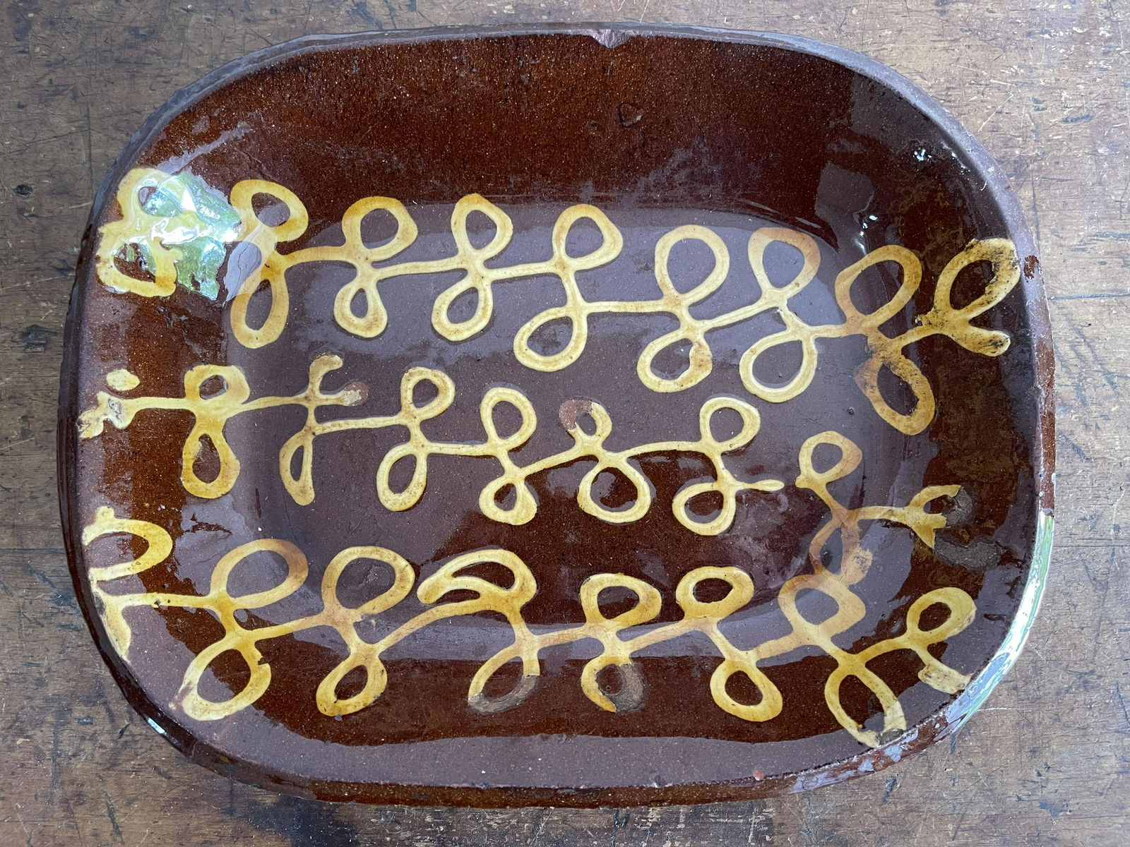 Antique redware decorated platter (1 of 2)