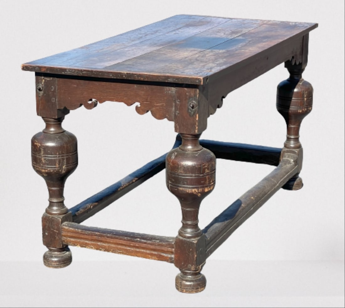 C. 1600 LATE ELIZABETHAN ERA SERVING TABLE: C. 1600 LATE ELIZABETHAN ERA SERVING TABLE, VERY LARGE TRUMPET LEGS, BOX STRETCHER , NICELY CARVED SKIRT, 28 X 56 X 31.5 T