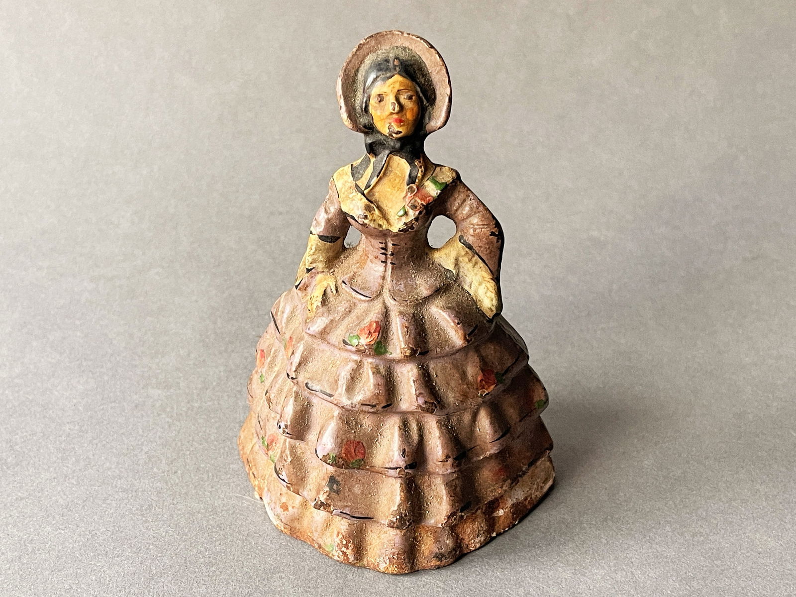 SMALL PAINTED IRON LADY DOORSTOP (1 of 2)