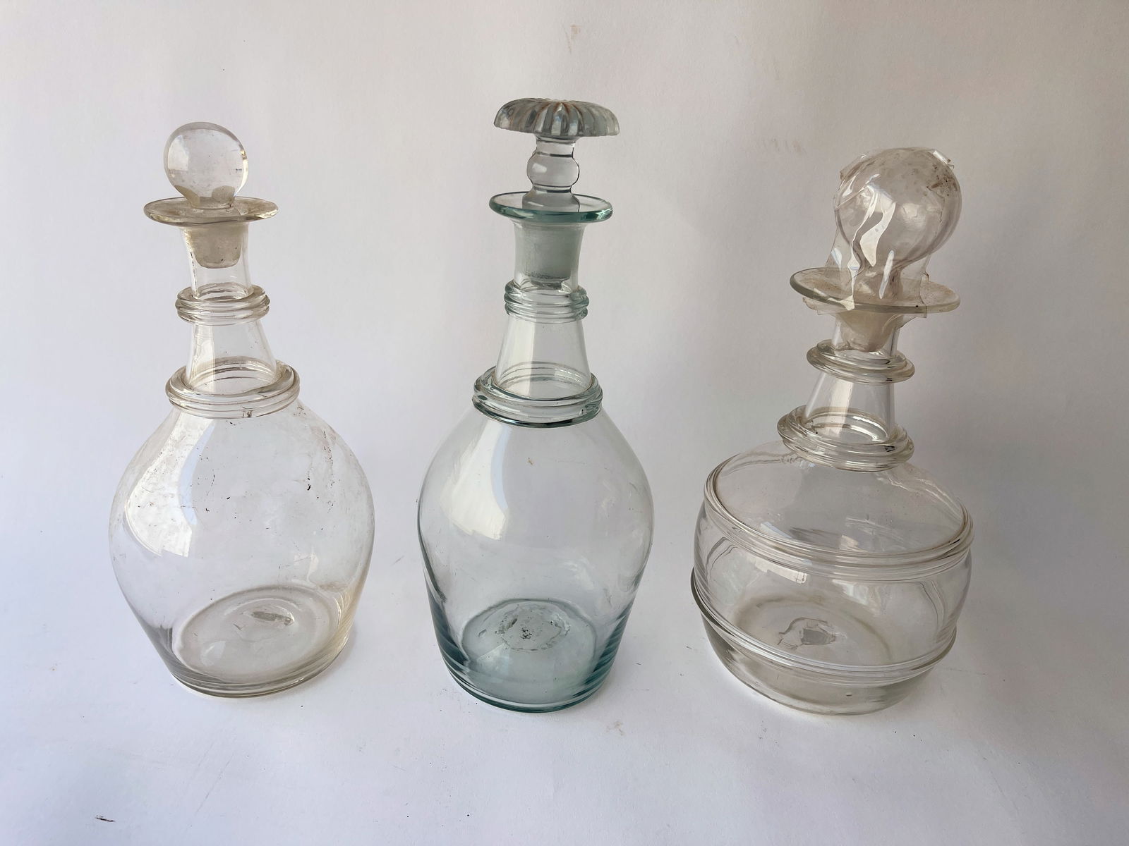 THREE BLOWN GLASS DECANTERS (1 of 2)