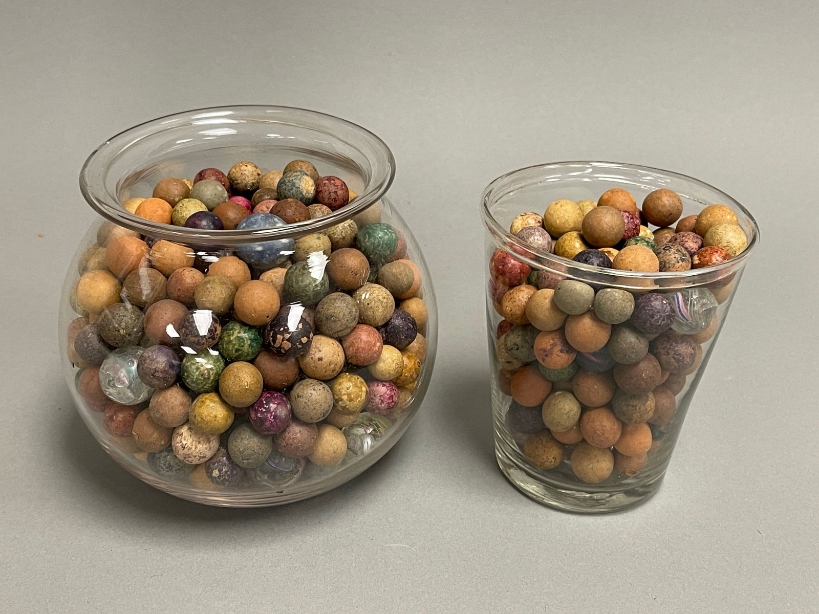 GROUPING OF COLORFUL CLAY MARBLES: GROUPING OF COLORFUL CLAY MARBLES, SOME SWIRLS AS FOUND