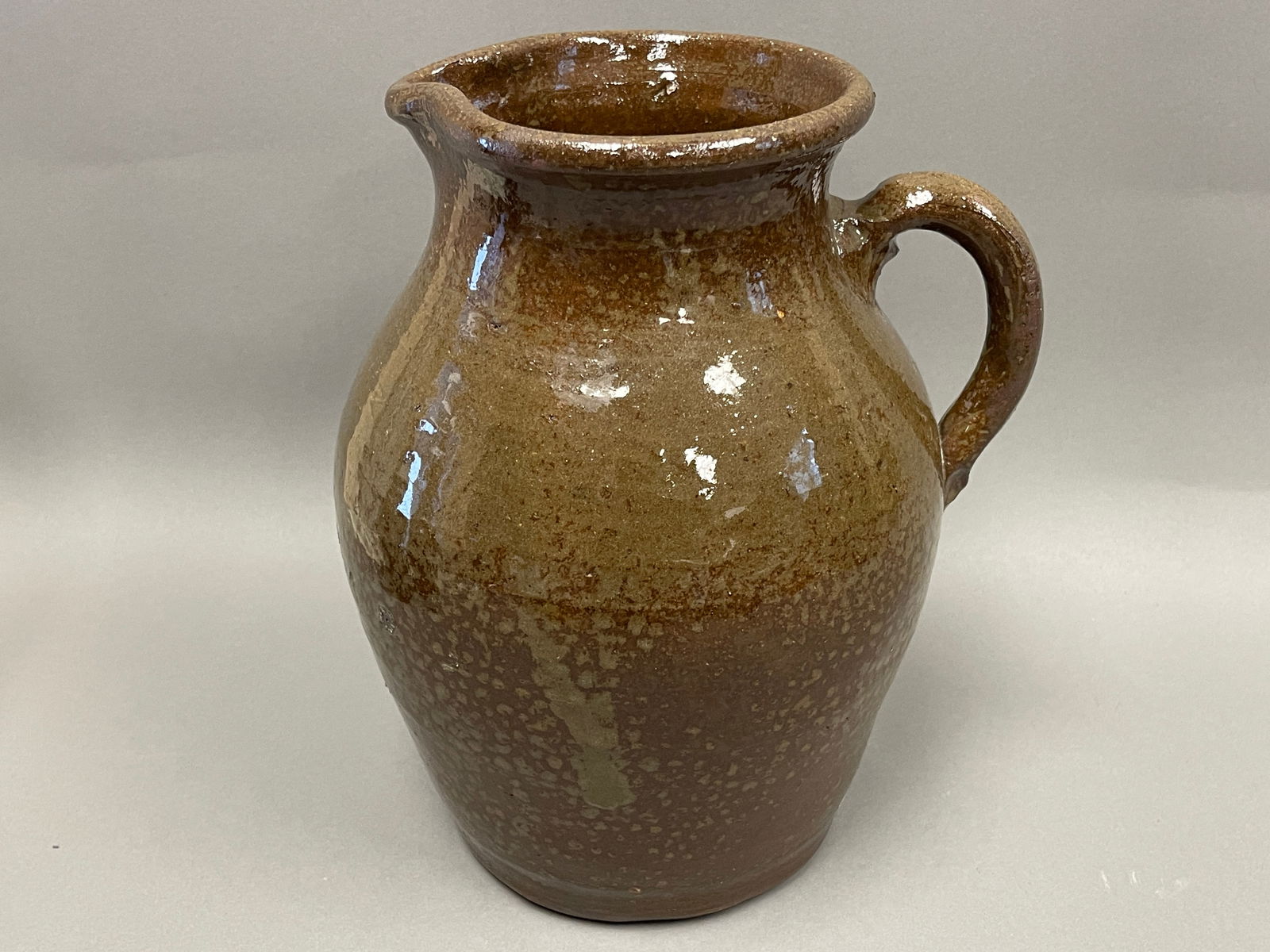 19TH C REDWARE PITCHER WITH OLIVE GLAZE (1 of 7)