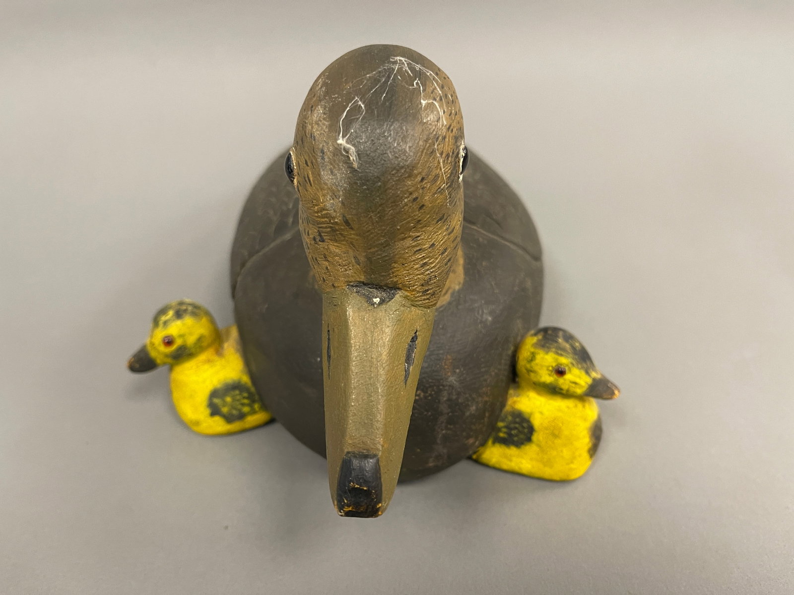 PAINTED AND CARVED DECOY WITH DUCKLINGS: PAINTED AND CARVED DECOY WITH DUCKLINGS, 14"