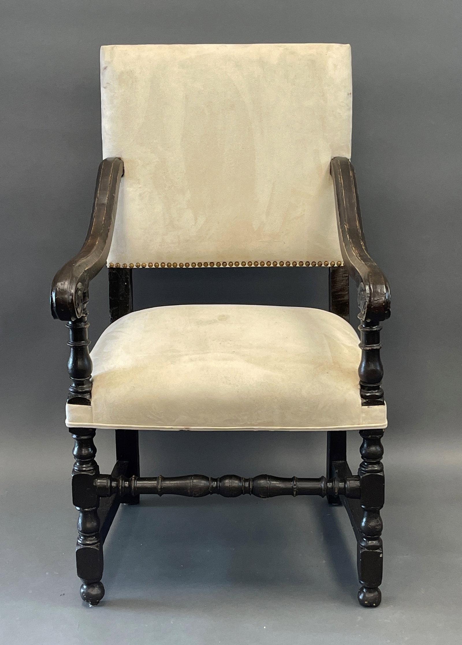 EUROPEAN WALNUT ARMCHAIR: EUROPEAN WALNUT ARMCHAIR , SCROLLED ARMS , TURNED STRETCHER, WHITE SUEDE UPHOLSTERY 1680-1700 44" X 24" X 21S