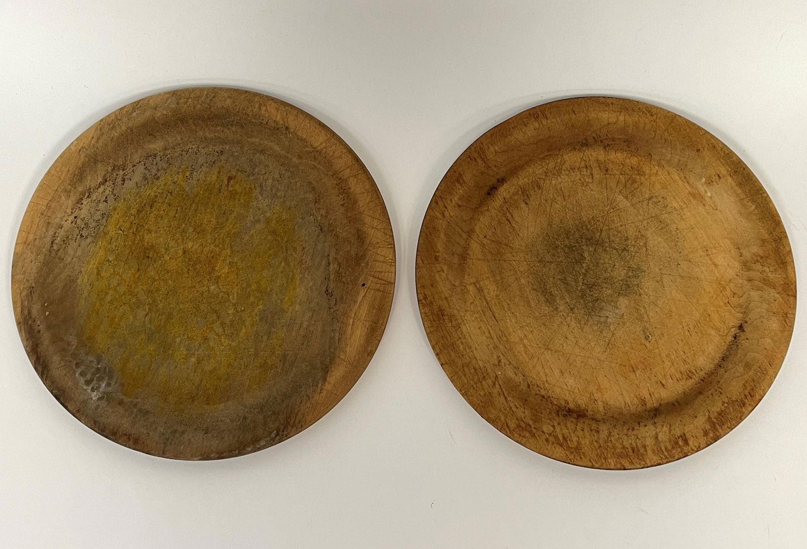 TWO PRIMITIVE TREEN PLATES (1 of 4)