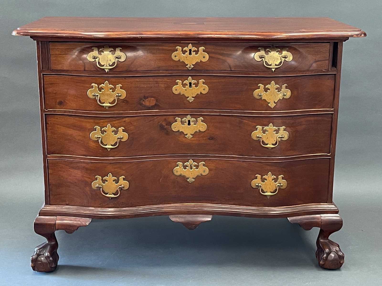 4 DRAWER SERPENTINE CHIPPENDALE CHEST BALL AND CLAW FEET: 4 DRAWER SERPENTINE CHIPPENDALE CHEST BALL AND CLAW FEET MAHOGANY, CIRCA 1750-1780 , PREVIOUSLY TRANSITIONED FROM A DESK.42 x 21 x 36
