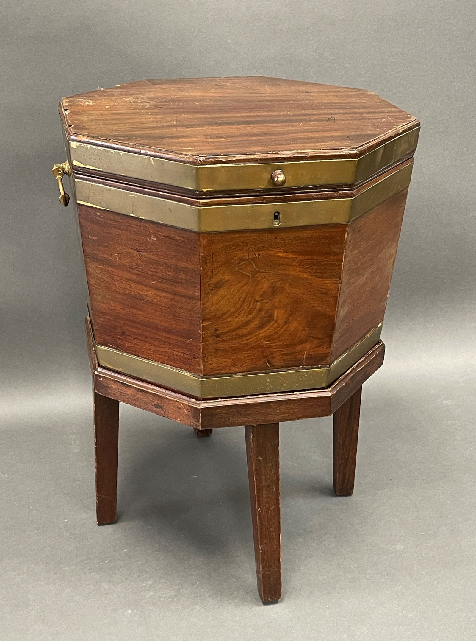 PERIOD BRASS BOUND CELLARETTE: PERIOD OCTAGONAL BRASS BOUND CELLARETTE WITH ORIGINAL INTERIOR AND KEY 18 X 18 X 26