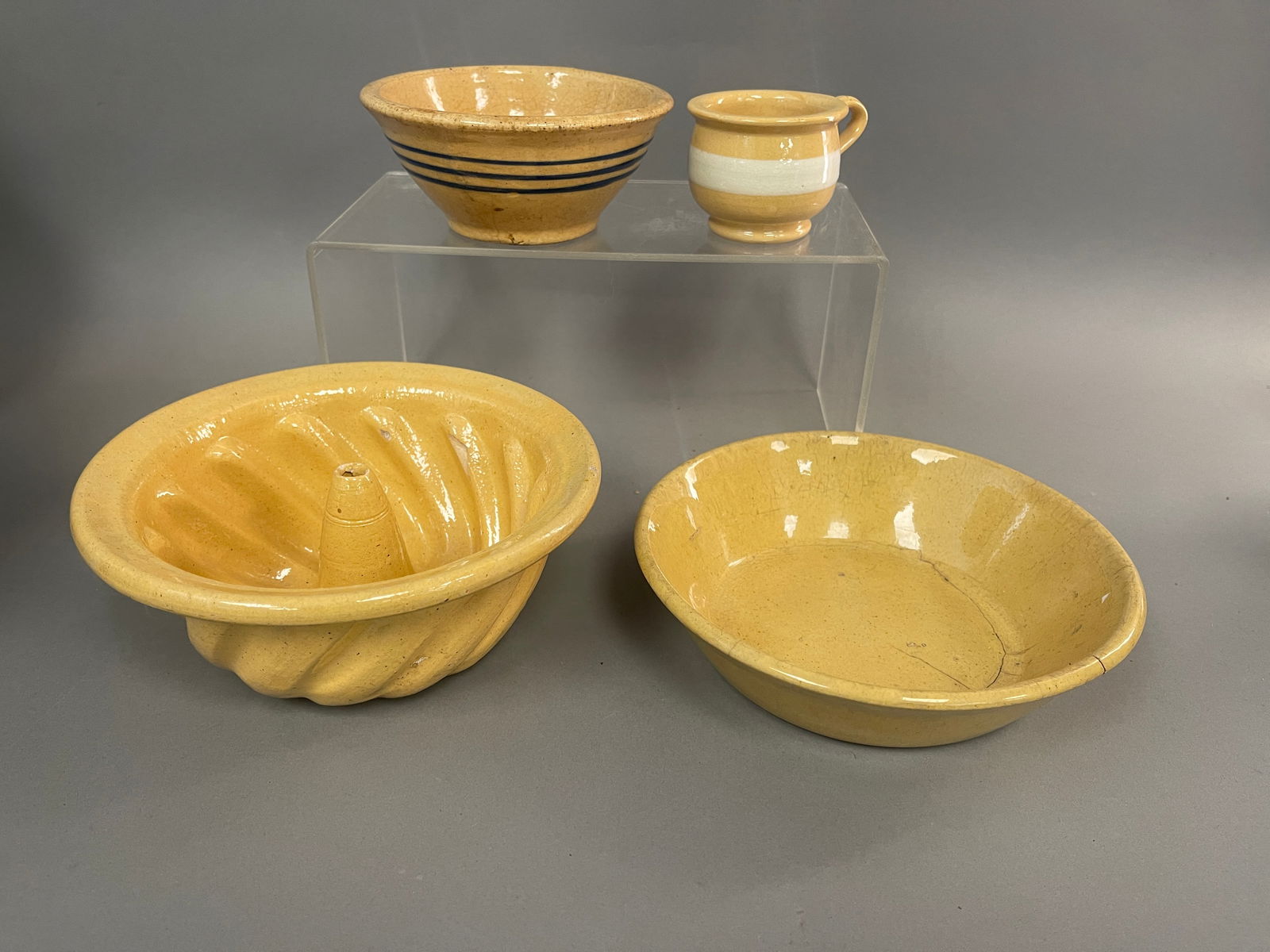 GROUPING OF YELLOWWARE: YELLOWWARE LOT: 4 PCS 19TH C MINI YW HANDLED POTTY WITH WHITE BAND. MINT 3 3/8” ACROSS X 2 1/8” TALL. 1880-1920 (65-150 $125-225)DD1880 SMALL YELLOW WARE BOWL 5” WITH BLUE BANDS EP19