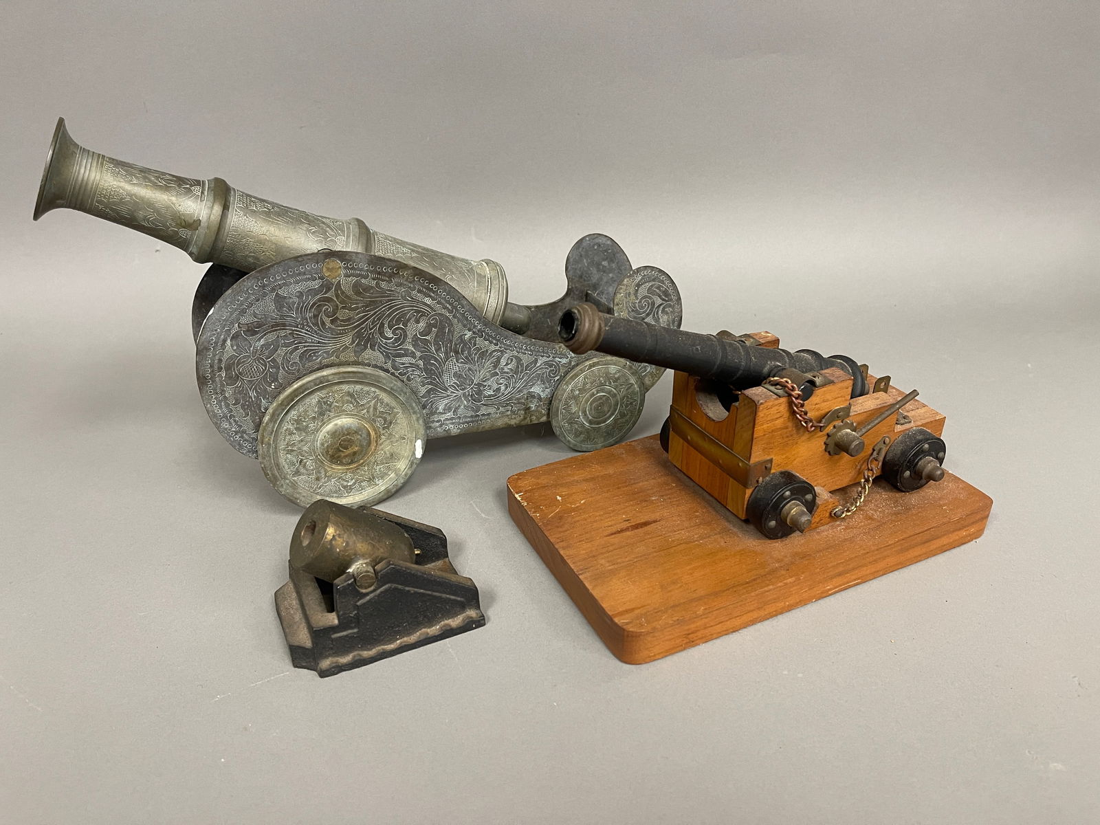 GROUPING OF THREE TABLE TOP CANNONS (1 of 3)