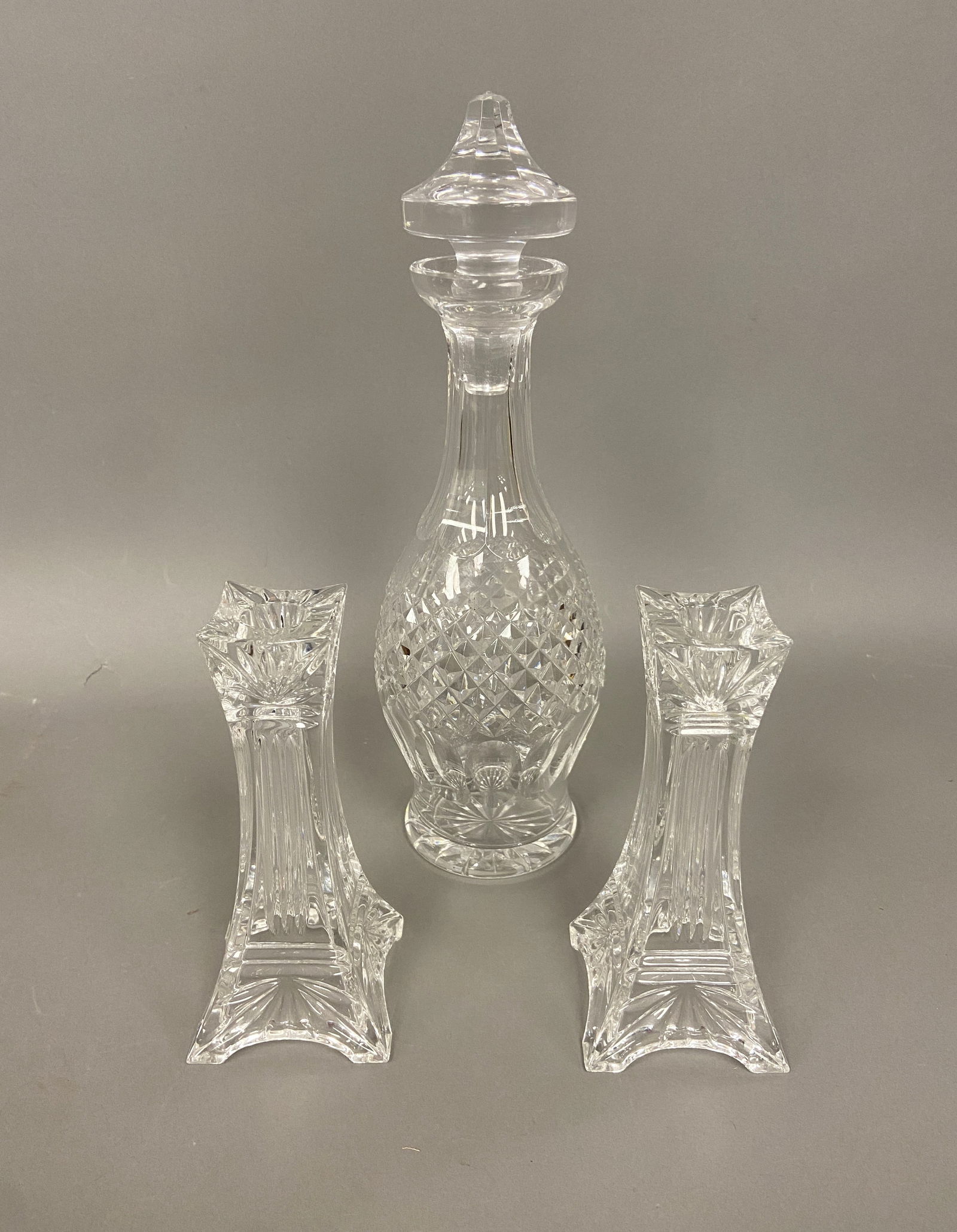 GROUPING OF WATERFORD CRYSTAL: WATERFORD CRYSTAL GLASS LOT DECANTOR 5" X 14" AND PAIR OF CANDLESTICKS 7" ALL SIGNED