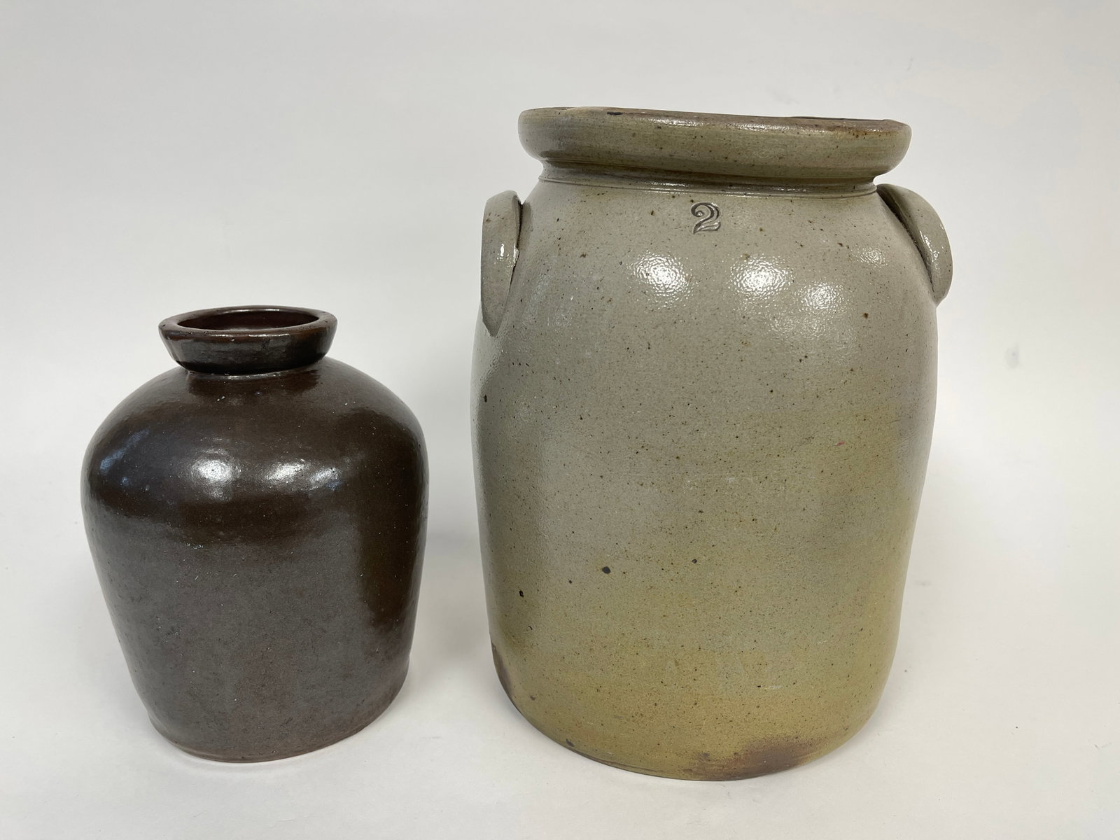 TWO STONEWARE CROCKS: TWO STONEWARE CROCKS, 11", 8"