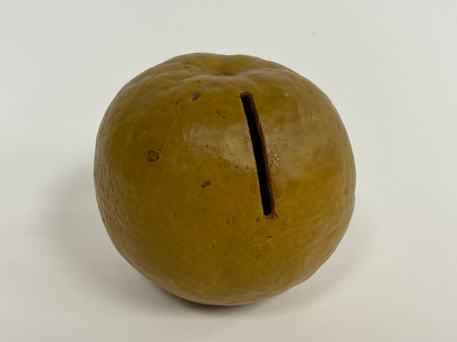 MID 19th C REDWARE ORANGE FRUIT BANK: MID 19th CENTURY PENNSYLVANIA REDWARE WELL TEXTURED ORANGE FRUIT BANK. Excellent condition. 3” diameter x 3 ¼” high.