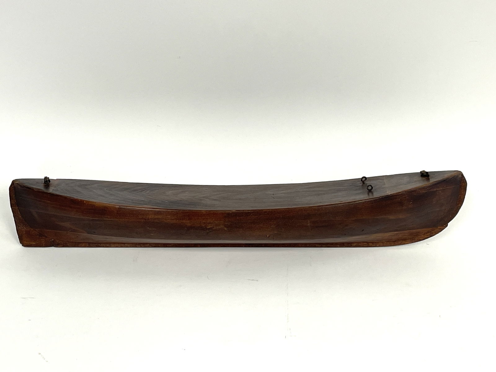 HANDCRAFTED WOODEN CARVED WHALE BOAT HULL: HANDCRAFTED WOODEN (Teak or Mahogany) CARVED WHALE BOAT HULL. Great color. Unique large size 23” long x 5 ½” wide x approx. 4” high. Very nice construction, Includes brass dav