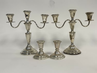 TWO PAIRS OF STERLING WEIGHTED CANDLESTICKS