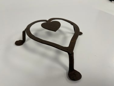 DOUBLE HEART SHAPED QA FOOTED FORGED IRON TRIVET