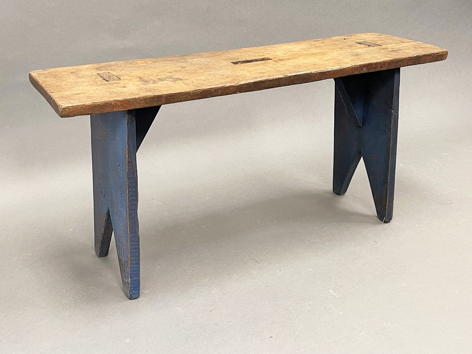 BLUE PAINTED MORTISED BENCH W/MEDIAL CARRYING TOP HANDHOLE: BLUE PAINTED MORTISED BENCH W/MEDIAL CARRYING TOP HANDHOLE 34" X 10" X 17"