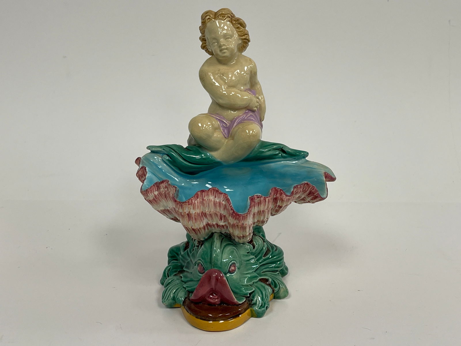 MAJOLICA ; SWEETMEATS SERVER OF PUTTI HOLDING SCALLOP SHELL, WHILE RIDING A FISH , ATT. TO GEORGE (1 of 4)