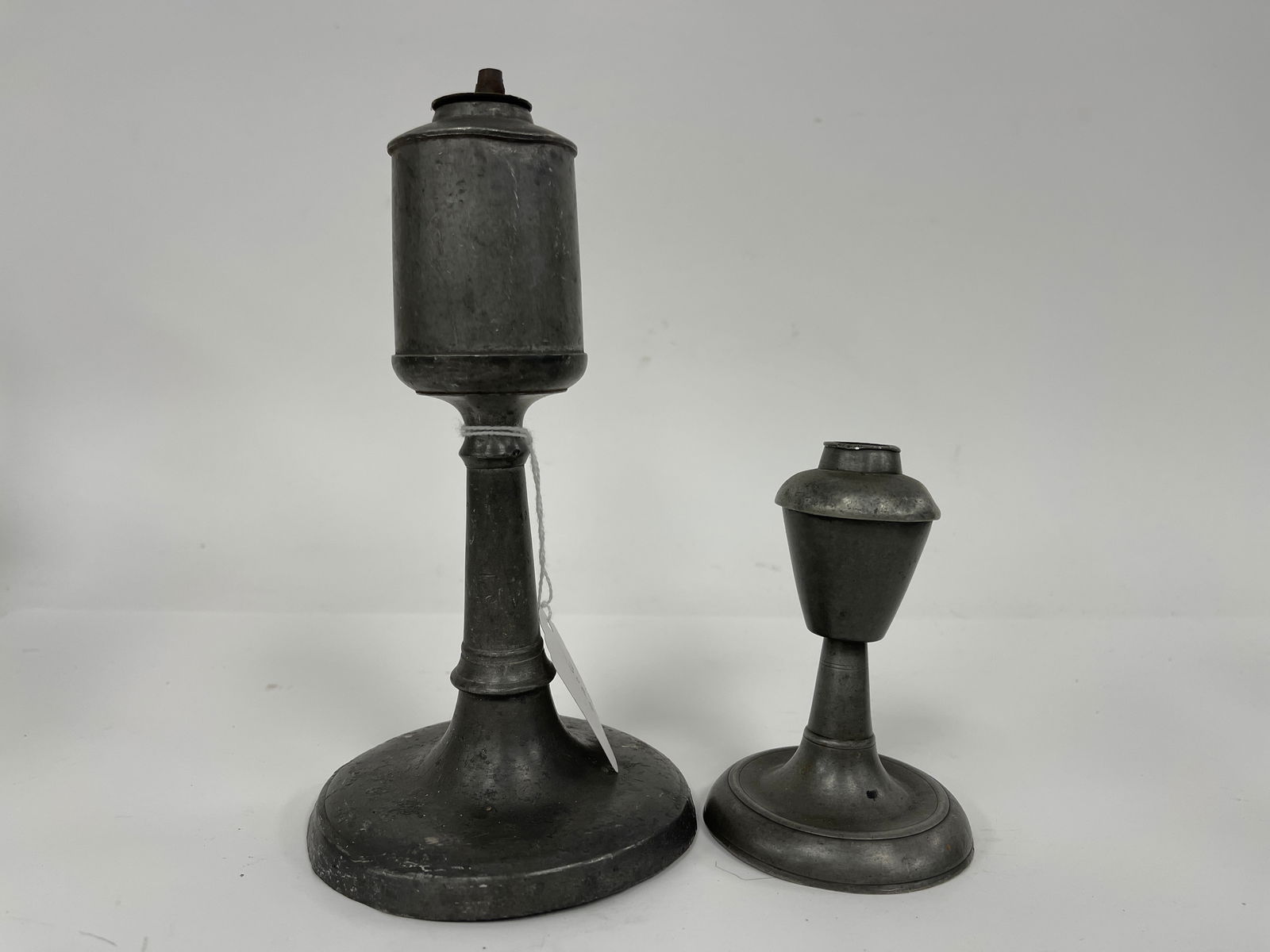TWO PEWTER WHALE OIL LAMPS: TWO PEWTER WHALE OIL LAMPS 8" , 4.5"