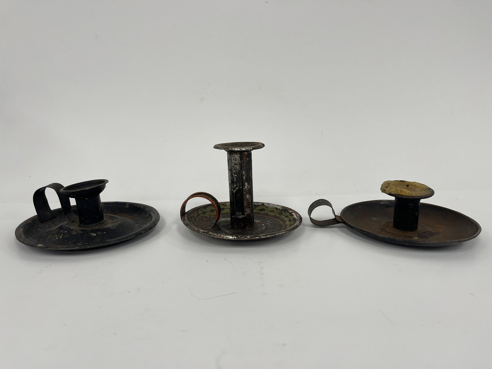 GROUPING OF THREE TIN CANDLE DISHES ONE PUSH UP: GROUPING OF THREE TIN CANDLE DISHES ONE PUSH UP 6 X 4