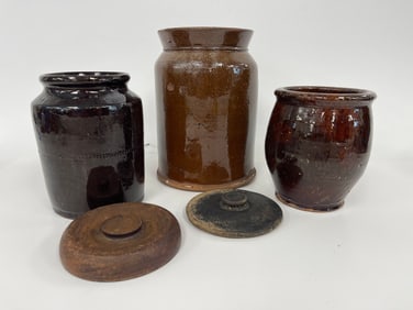 THREE REDWARE POTS , TWO WITH COVERS