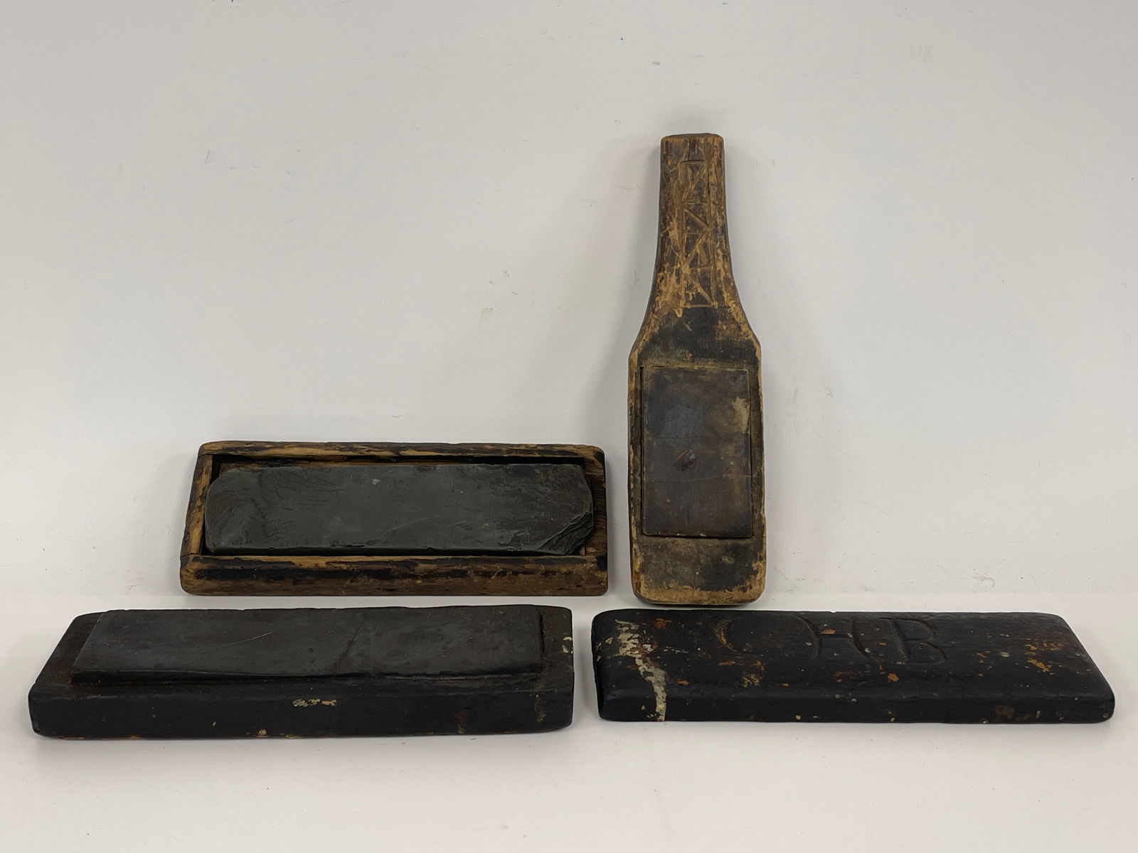GROUPING OF THREE PRIMITIVE SHARPENING ITEMS ONE MARKED "BLAKE" (1 of 4)