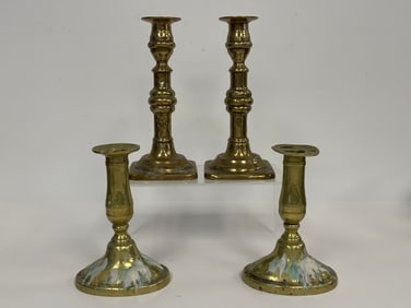 TWO PAIRS OF BRASS CANDLESTICKS