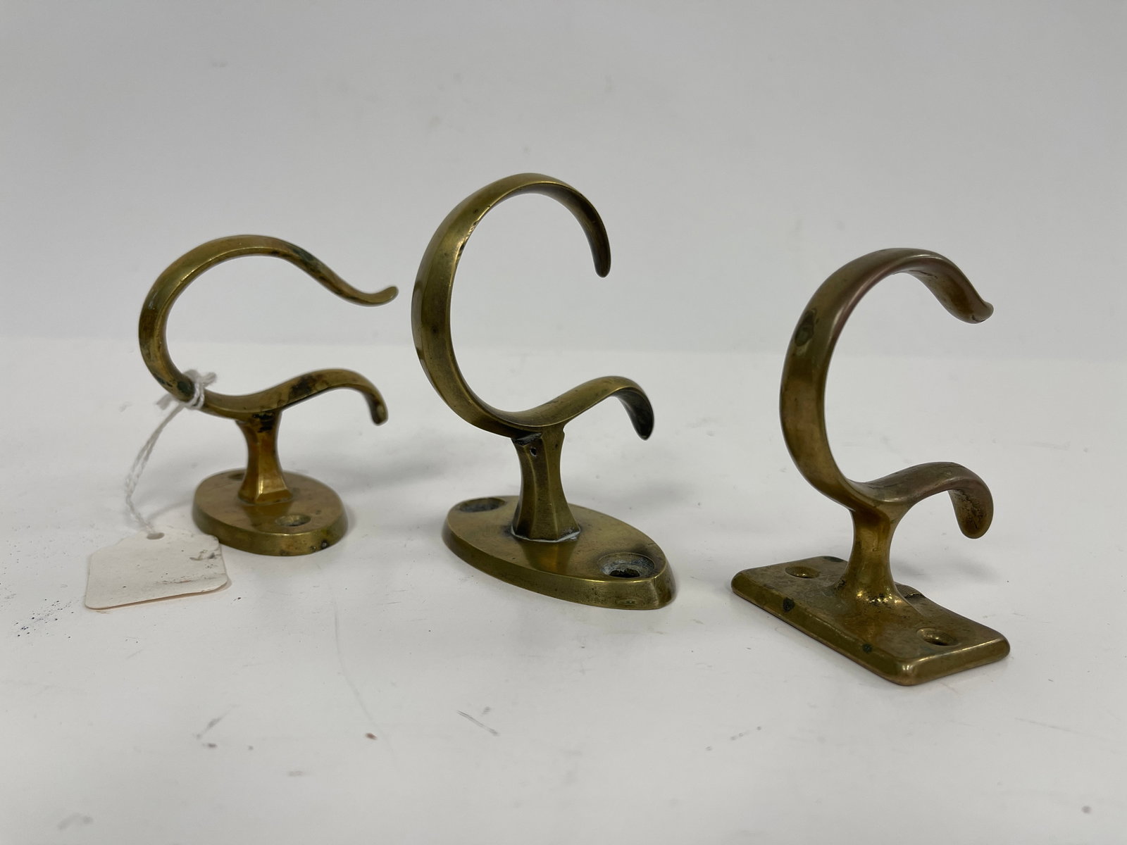 THREE BRASS JAMB HOOKS: THREE BRASS JAMB HOOKS