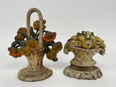 TWO CAST IRON FLORAL DOORSTOPS
