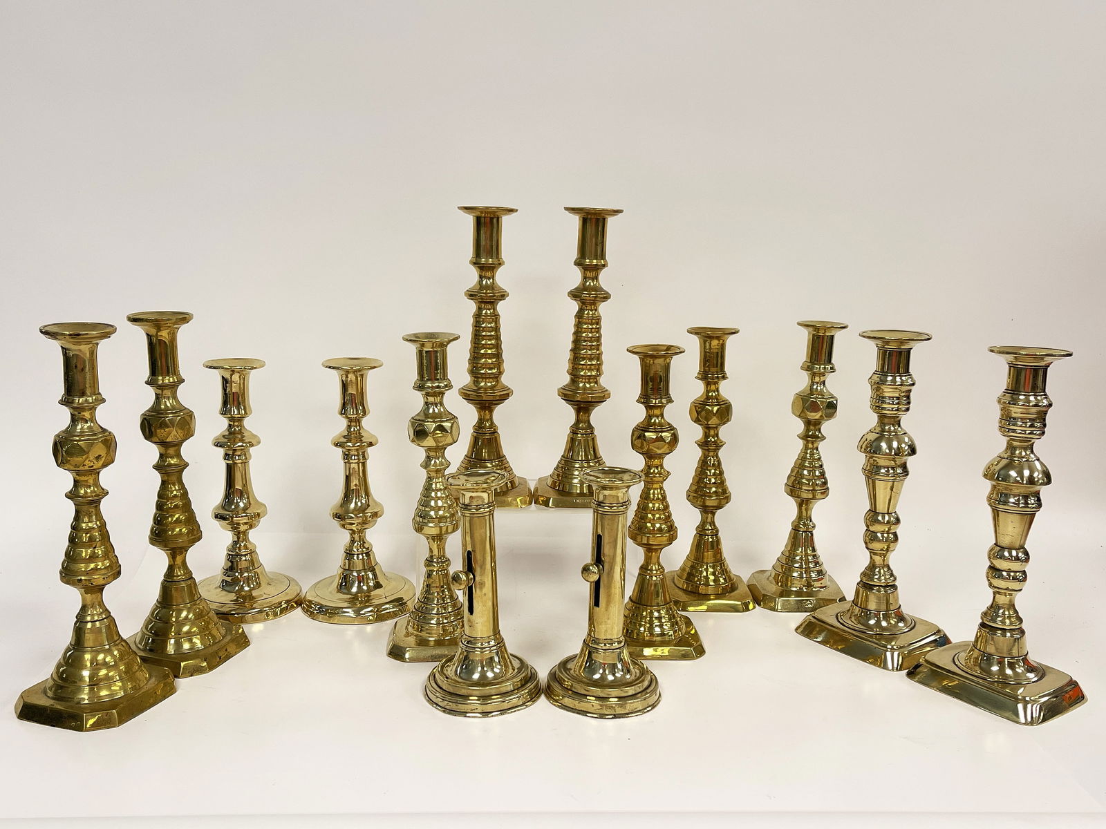 SEVEN PAIRS BRASS CANDLESTICKS (1 of 7)