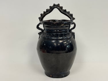 EARLY REDWARE VESSEL WITH BLACK GLAZE WITH TWISTED HANDLE