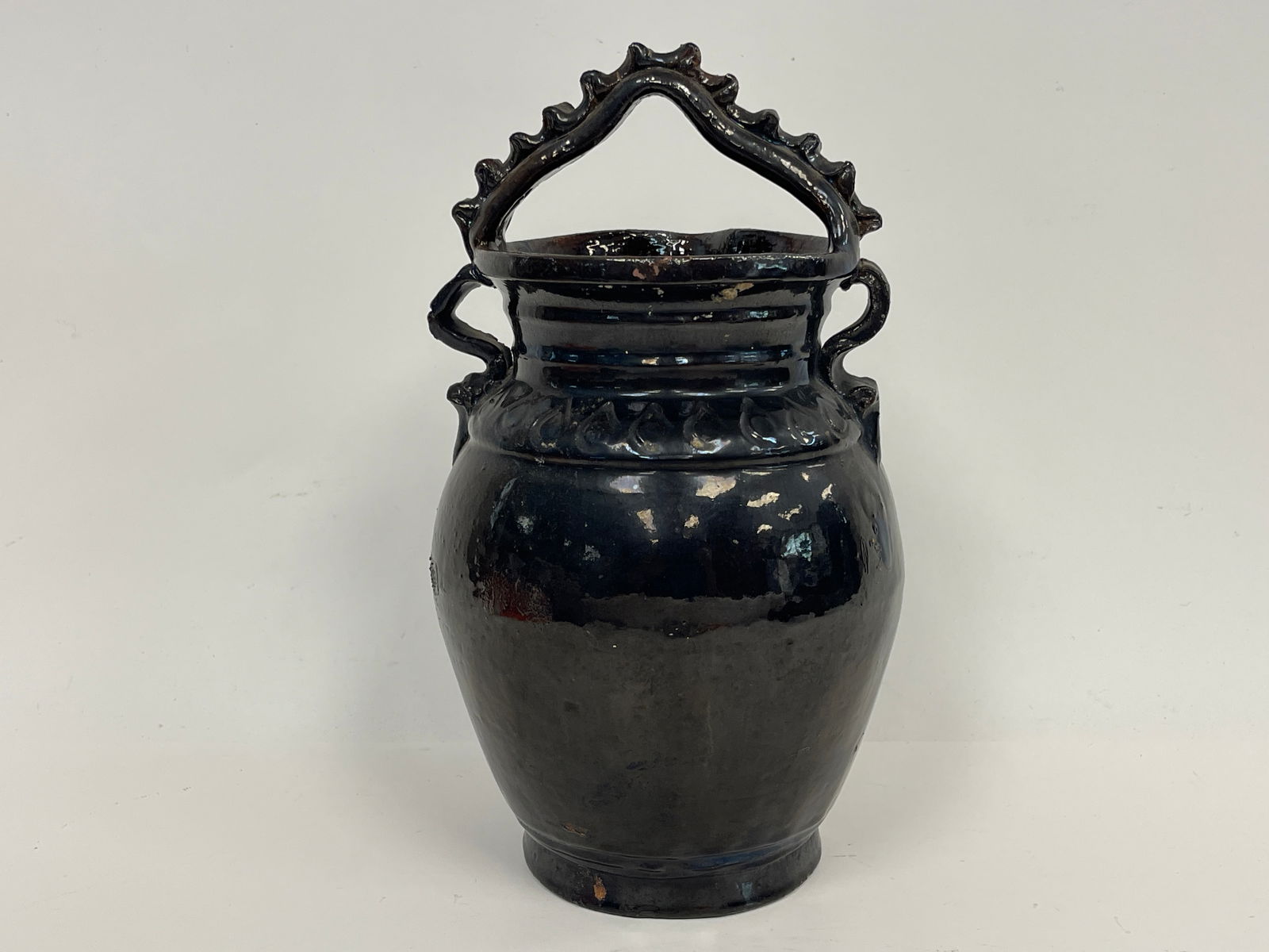 EARLY REDWARE VESSEL WITH BLACK GLAZE WITH TWISTED HANDLE: EARLY REDWARE VESSEL WITH BLACK GLAZE WITH TWISTED HANDLE 12 X 6