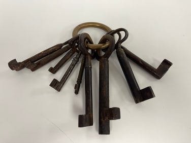 9 LARGE , EARLY KEYS ON A BRASS BULL RING