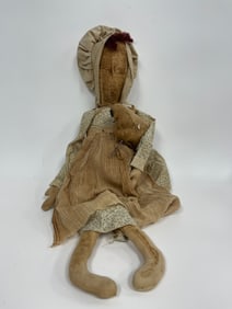 FOLKY COUNTRY FABRIC DOLL IN A TAN COLORED DRESS