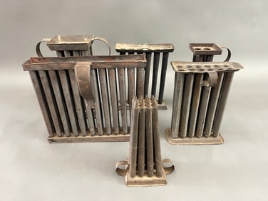 SIX CANDLE MOLDS
