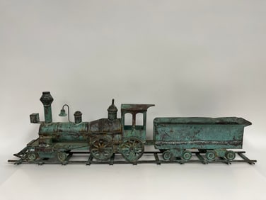 19TH C COPPER LOCOMOTIVE ON TRACK