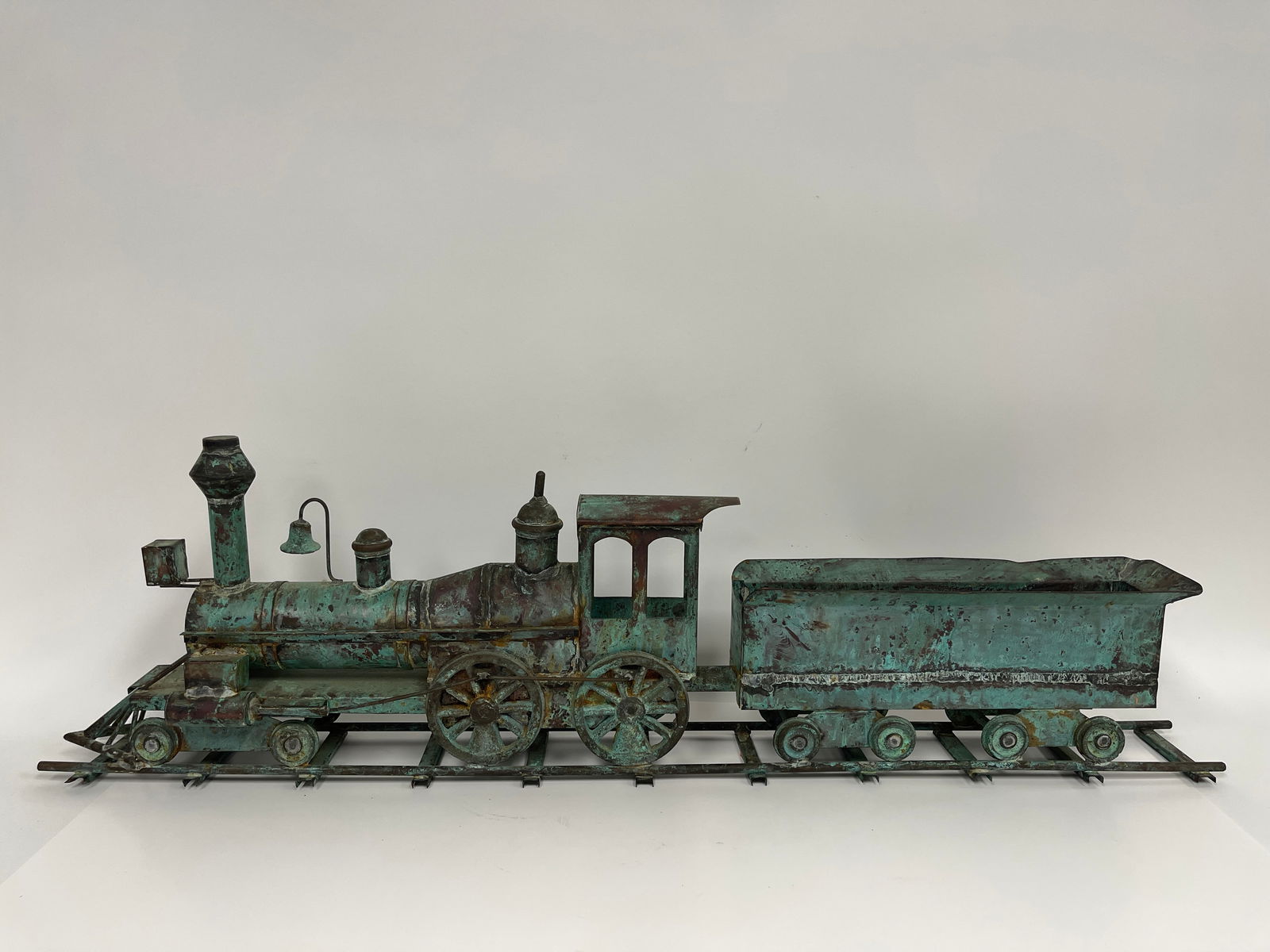 19TH C COPPER LOCOMOTIVE ON TRACK (1 of 4)