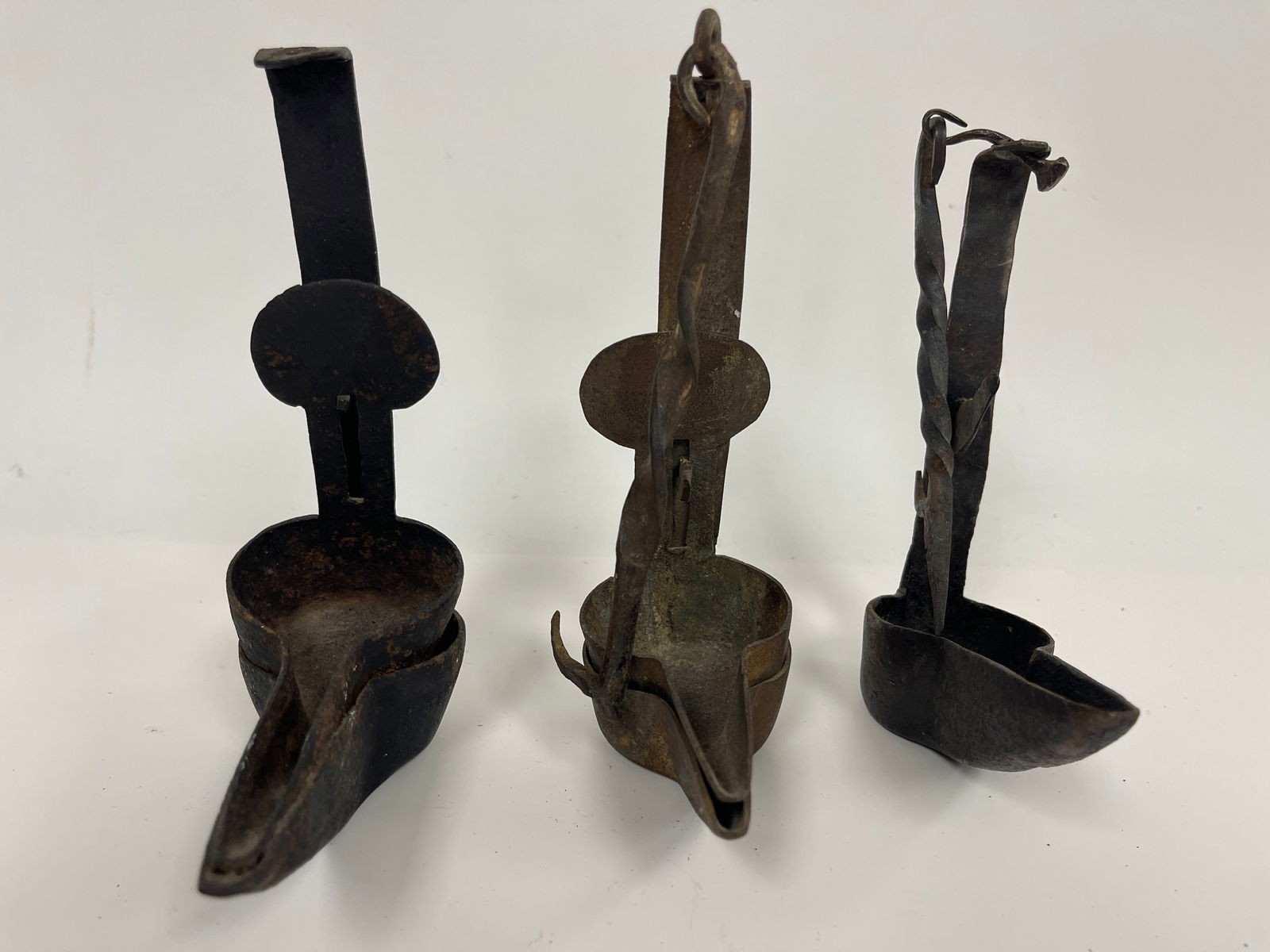 GROUPING OF THREE IRON GREASE LAMPS (1 of 4)