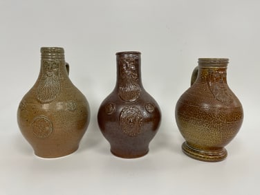 THREE REPRODUCTION BELLARMINE / BARTMANN JUGS