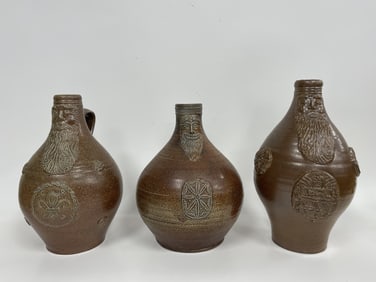 THREE REPRODUCTION BELLARMINE / BARTMANN JUGS