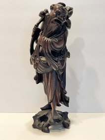 TALL WOOD CARVING OF A MAN