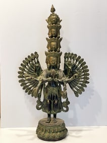 TALL BRONZE FOUR HEADED FIGURE